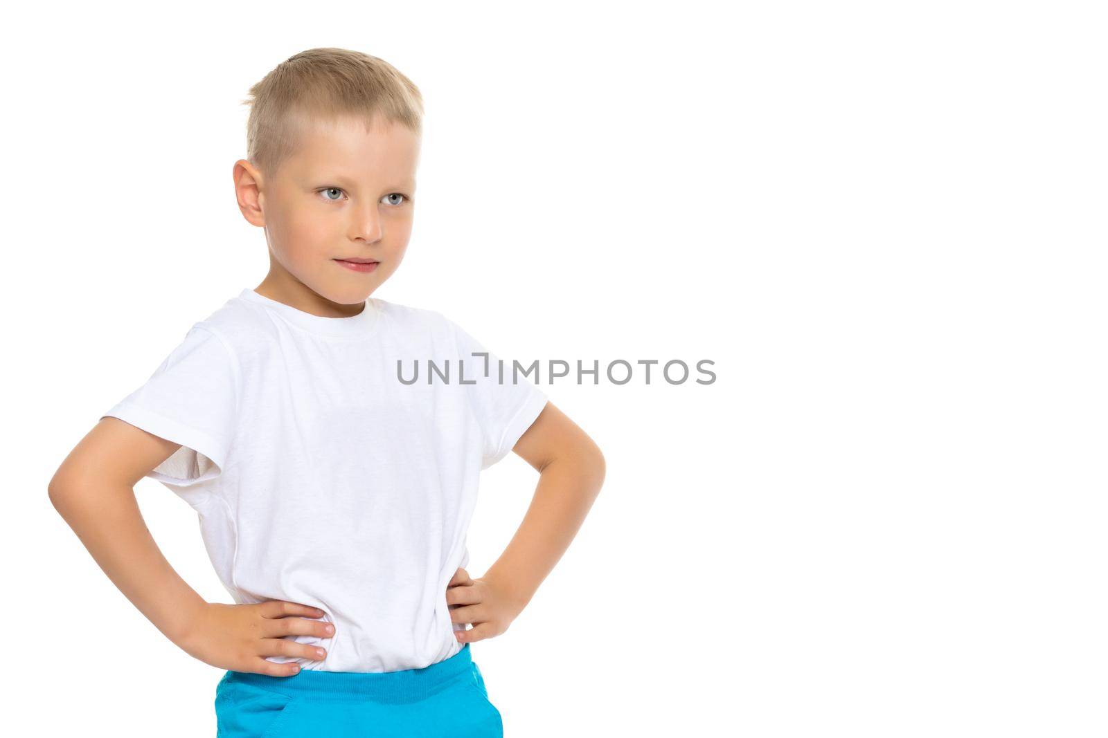 A cute little boy in a white T-shirt. The concept of promotional goods, inscriptions and drawings on clothes. Isolated on white background.