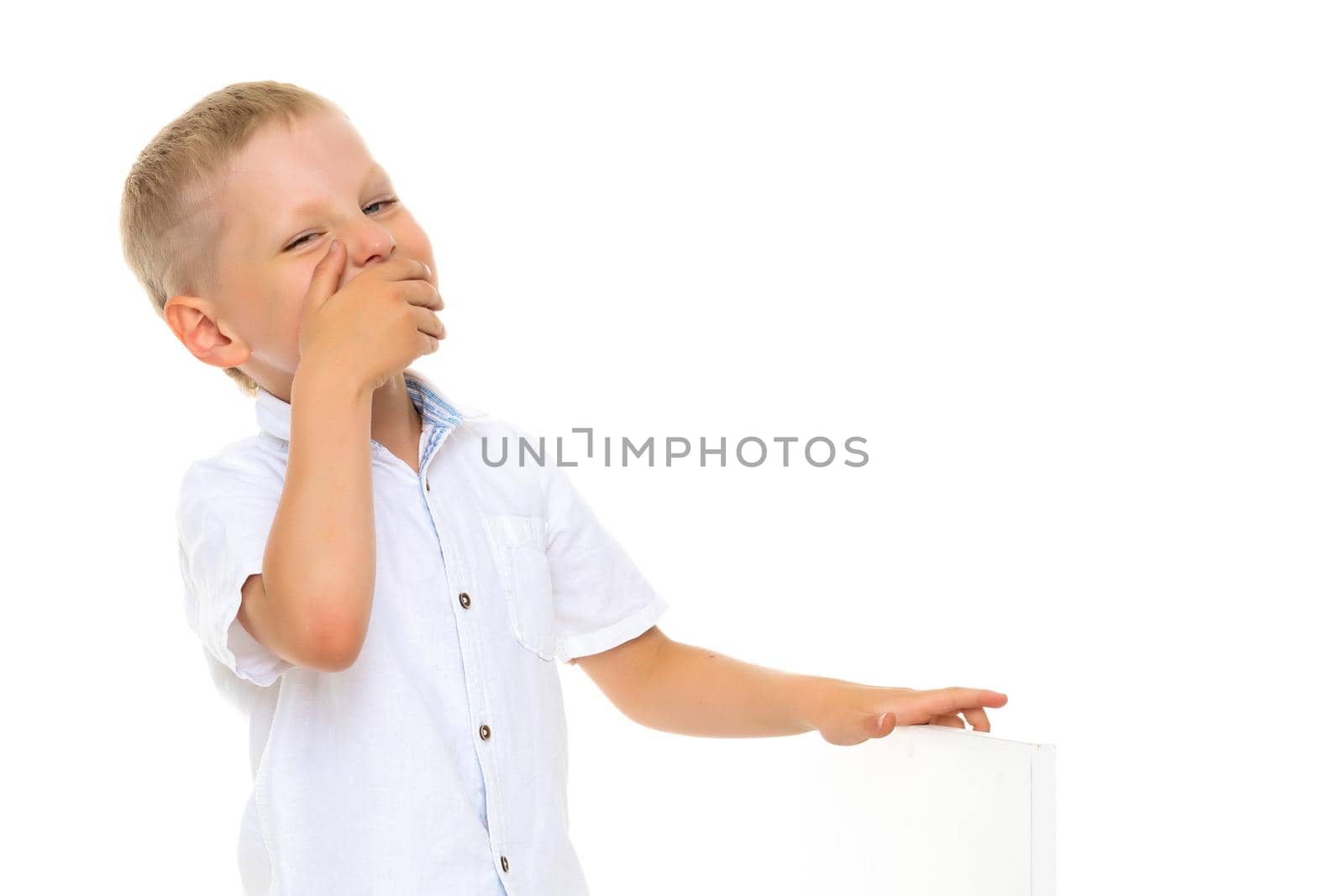 A beautiful little boy laughs fun. The concept of a happy childhood, well-being and family values. Isolated on white background.