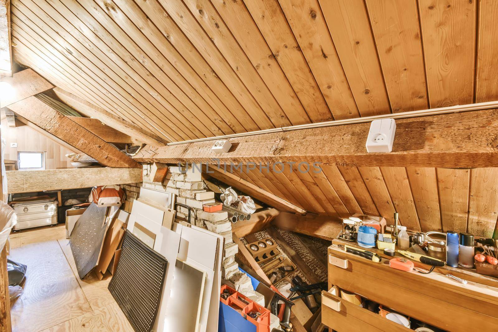Convenient attic with tools in stylish house
