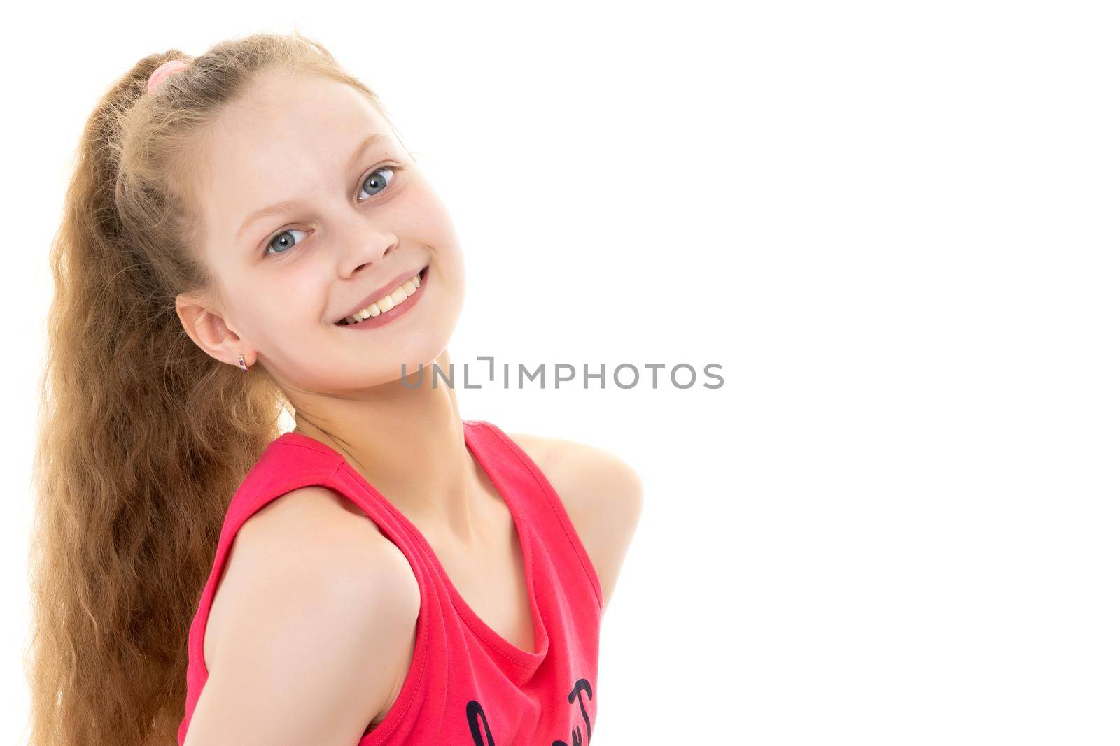 Beautiful little girl in a bathing suit lies in the studio on a white background. The concept is suitable for illustrating a child and family vacation by the sea, sun tanning on the beach.