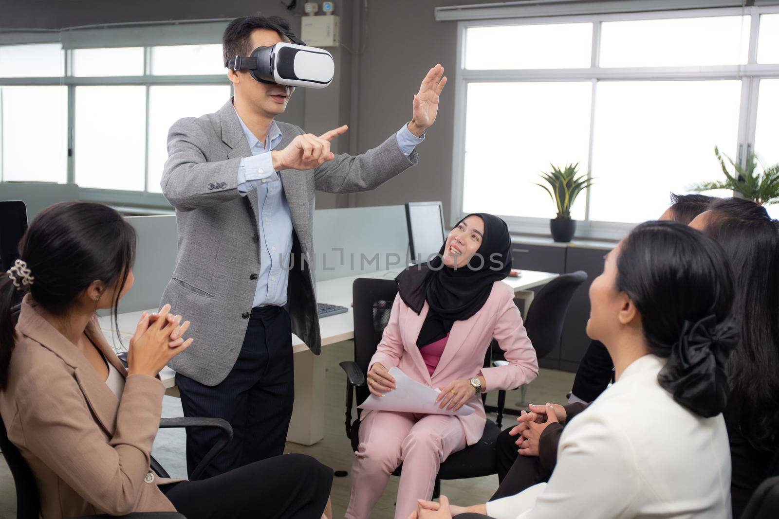 Young businessman is developer design testing of connection metaverse on vr realistic in the office, development global of engineer for creative application with collaboration, business concept. by nnudoo