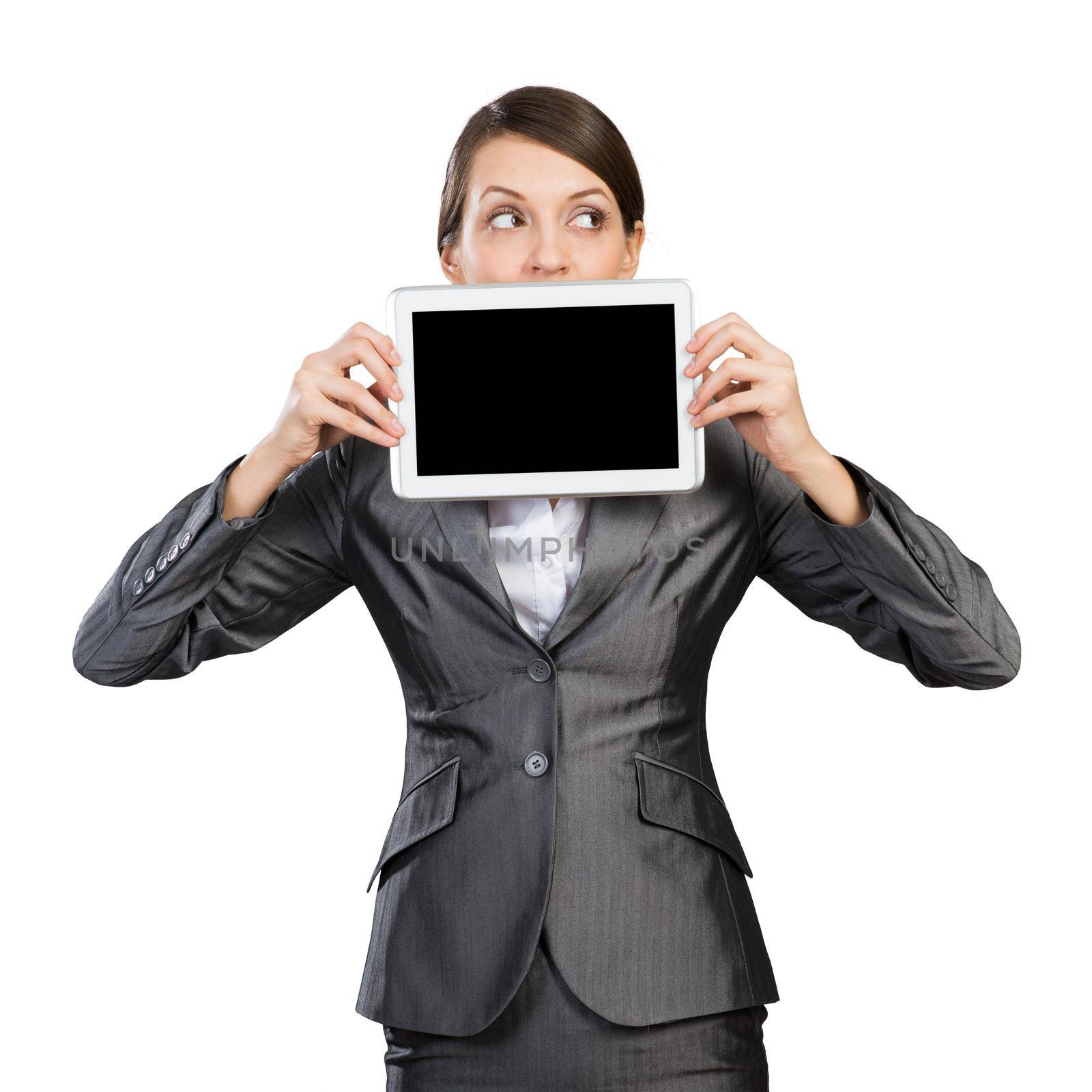 Businesswoman with tablet computer looking away by adam121