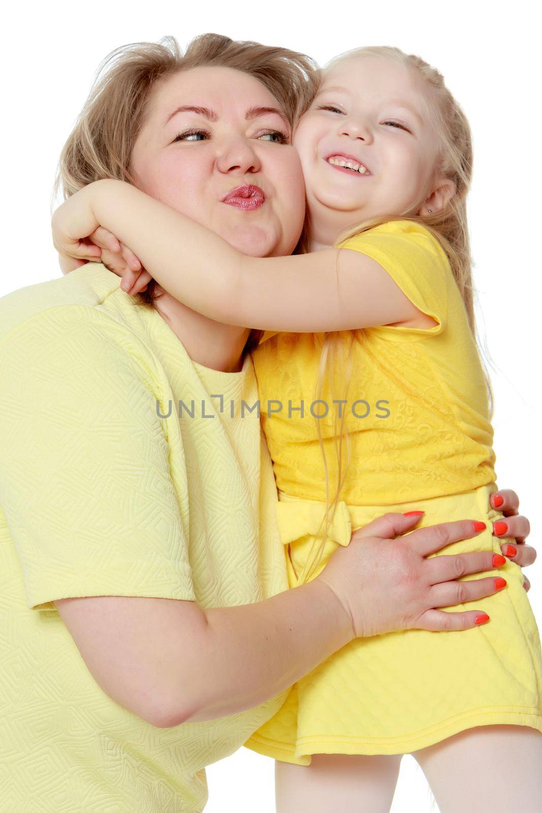 Mom and little daughter plus the size of the model, gently embra by kolesnikov_studio