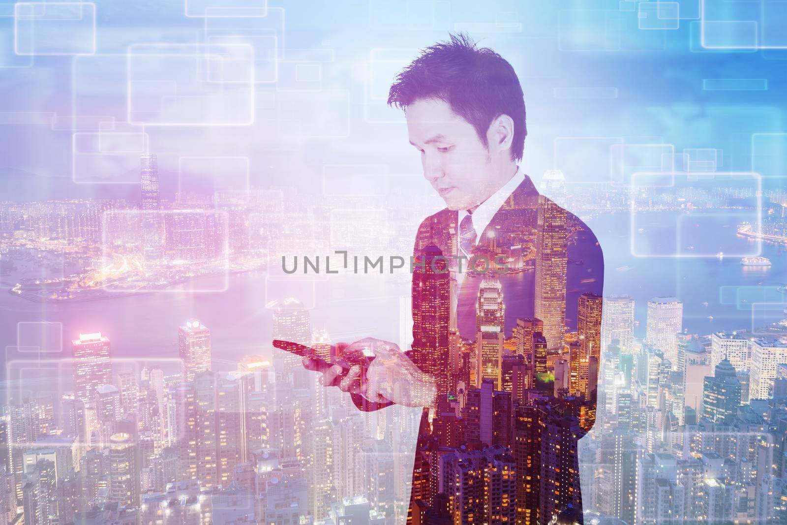 double exposure of business man using smart phone with a city background 