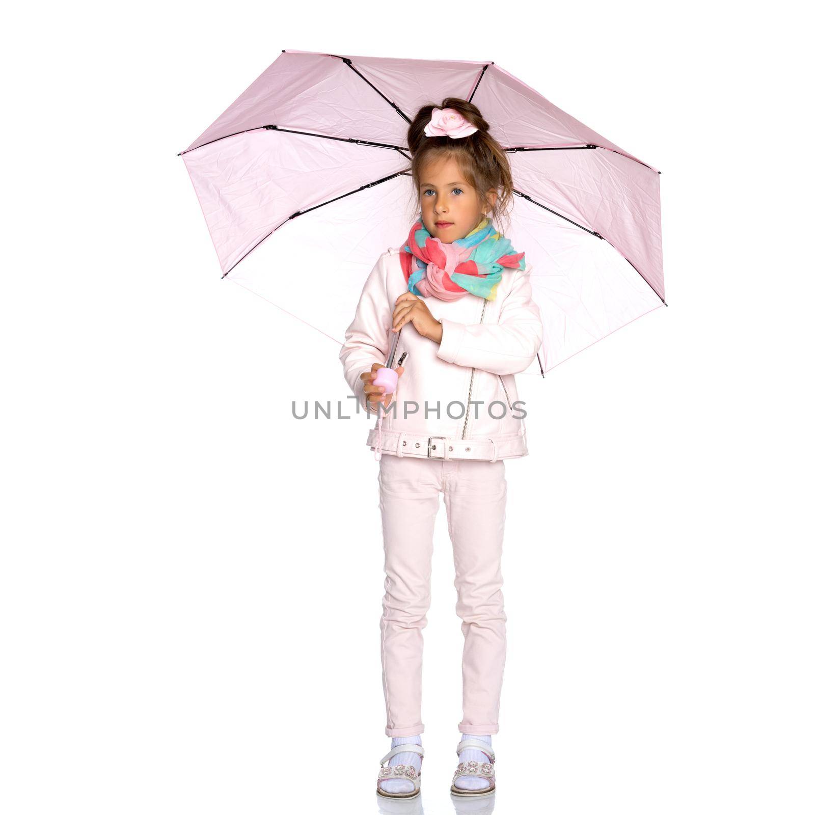 A nice little girl hid under an umbrella. The concept of a happy childhood, outdoor recreation, protection from bad weather. Isolated on white background.