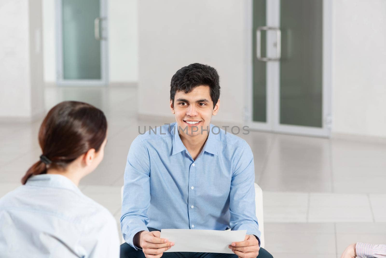 portrait of a young man at a business meeting by adam121