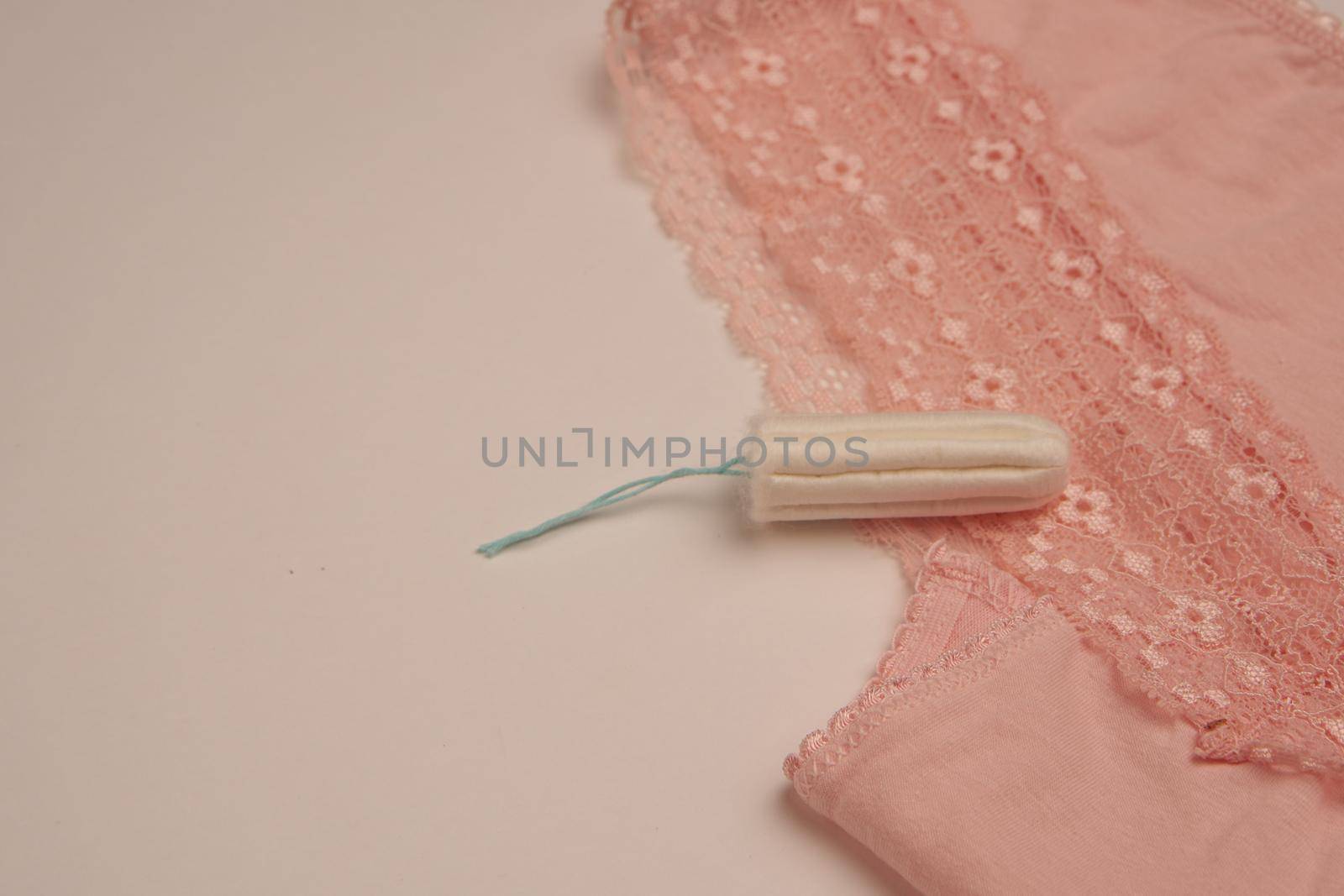 tampons pads underwear feminine hygiene protection light background by Vichizh