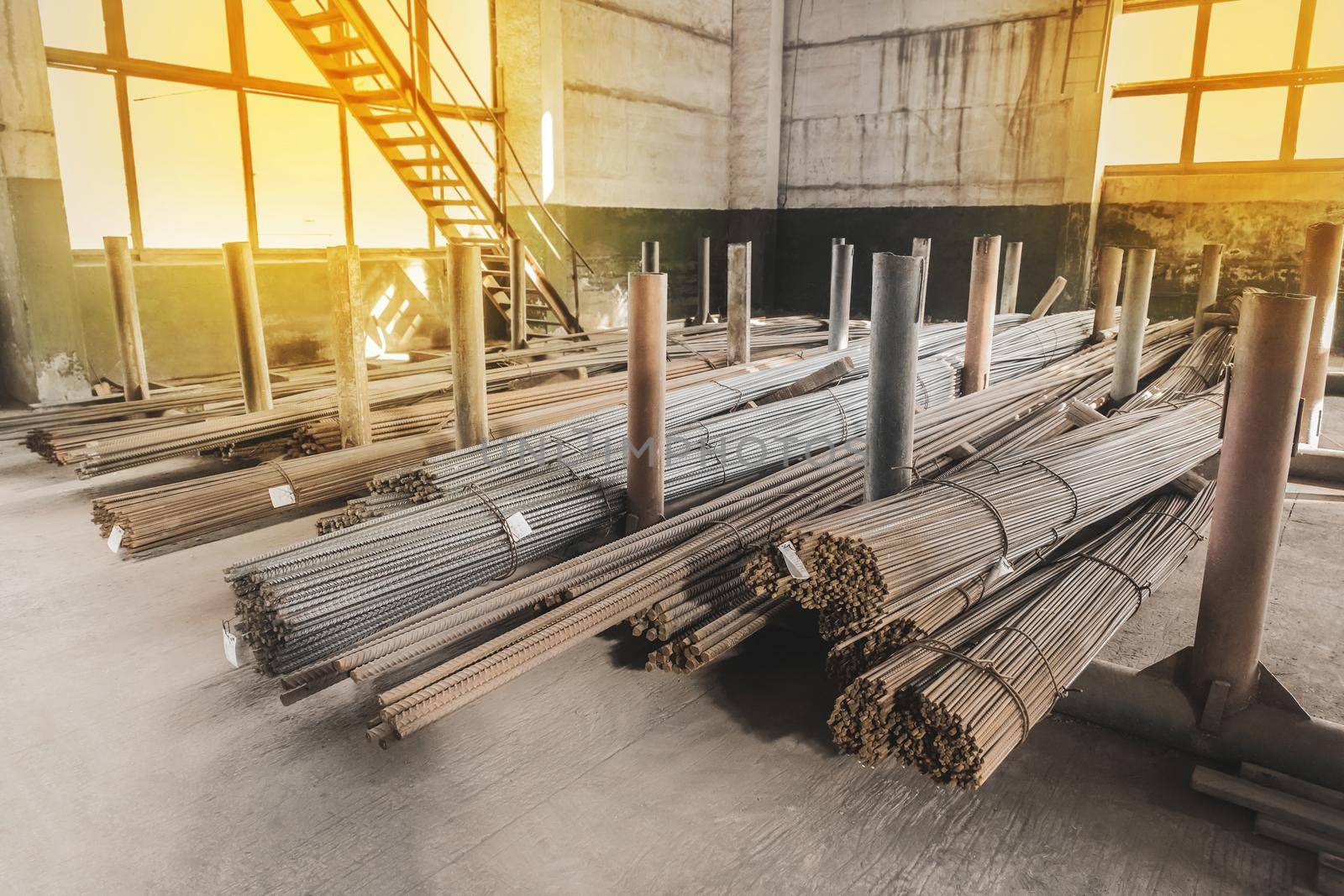 Storage of rebar or iron building materials in a warehouse or production hall of an industrial enterprise.