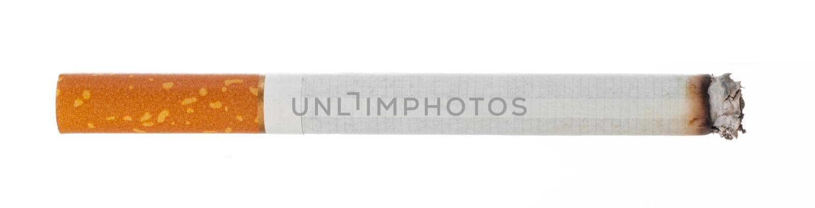 Lit cigarette isolated on white background close up top view