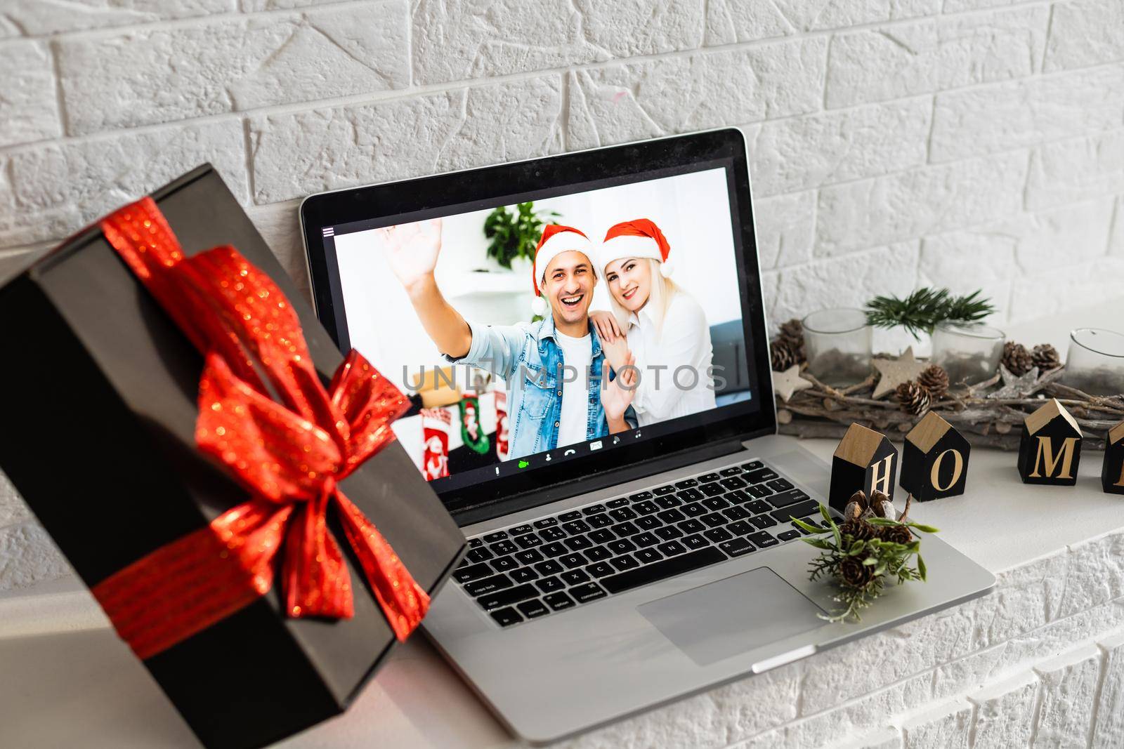 Virtual Christmas meeting team teleworking. Family video call remote conference Computer webcam screen view. Diverse portrait headshots meet working from their home offices. Happy hour party online. by Andelov13