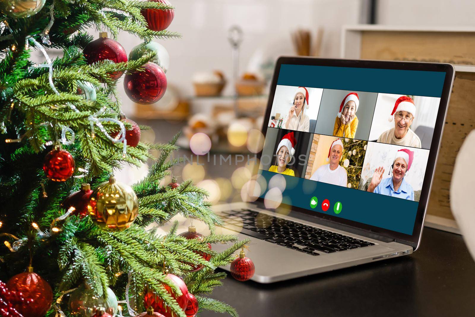 video call with happy diverse children on laptop computer in his workshop. Self-isolation and virtual online celebration at home concept. Christmas.