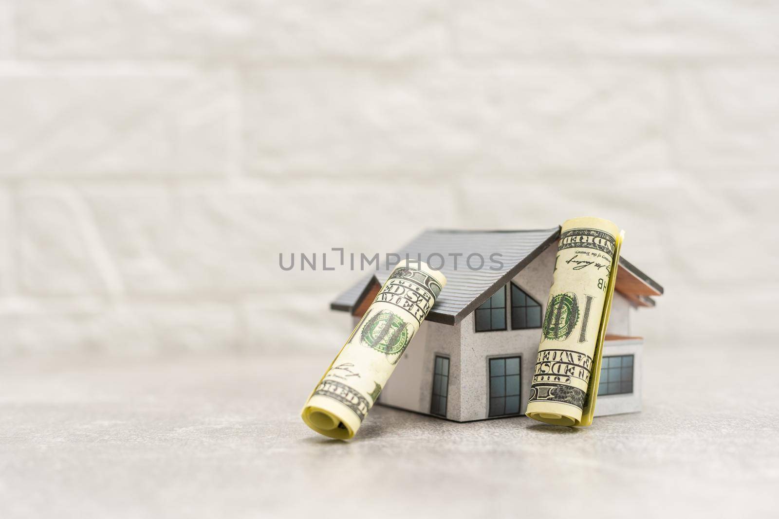 A close up of money and Mock up home, money accumulation, investment, banking or business services, wealth concept,