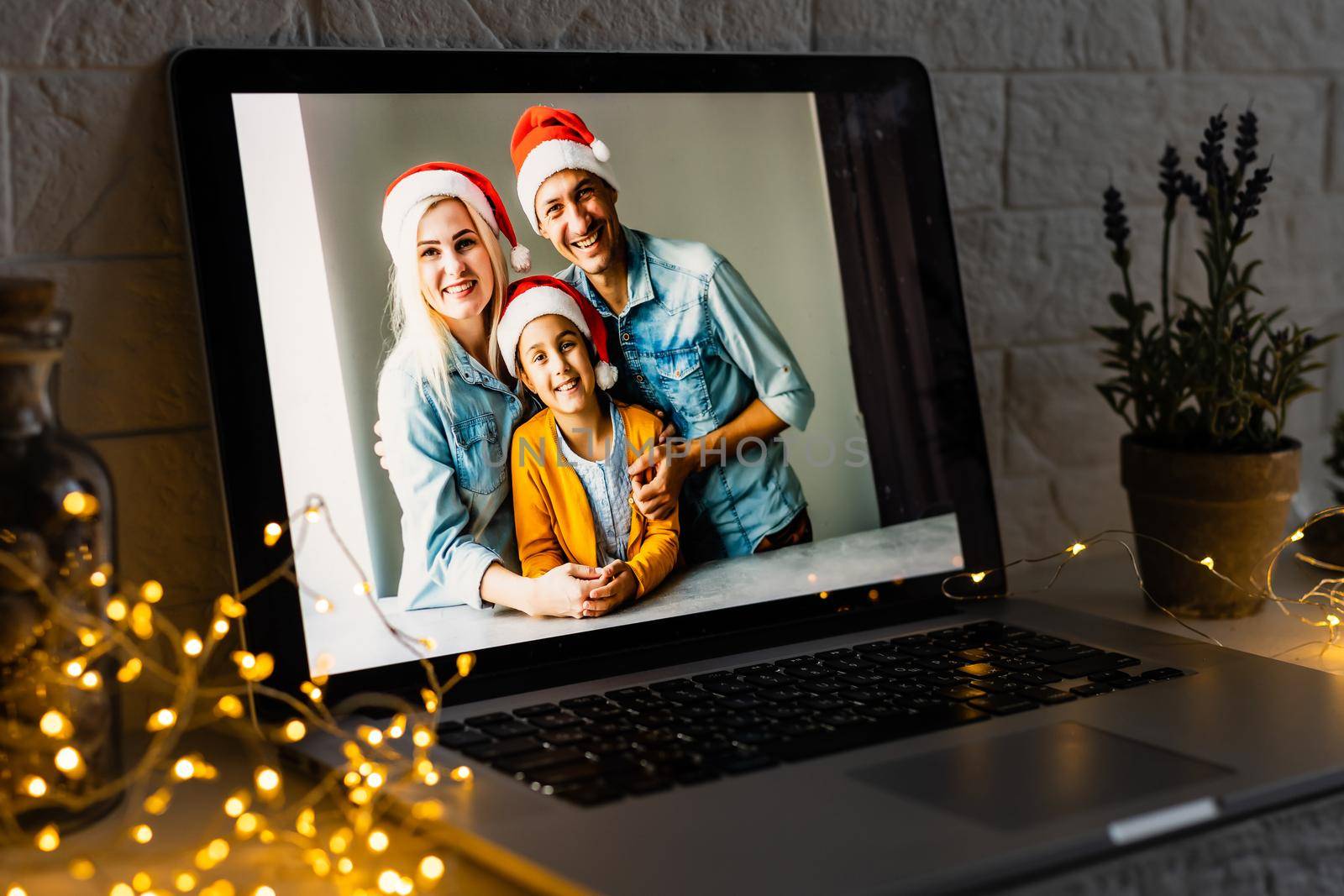 young family video call smiling and looking at webcam web, lovers greet friends merry christmas and happy new year by Andelov13