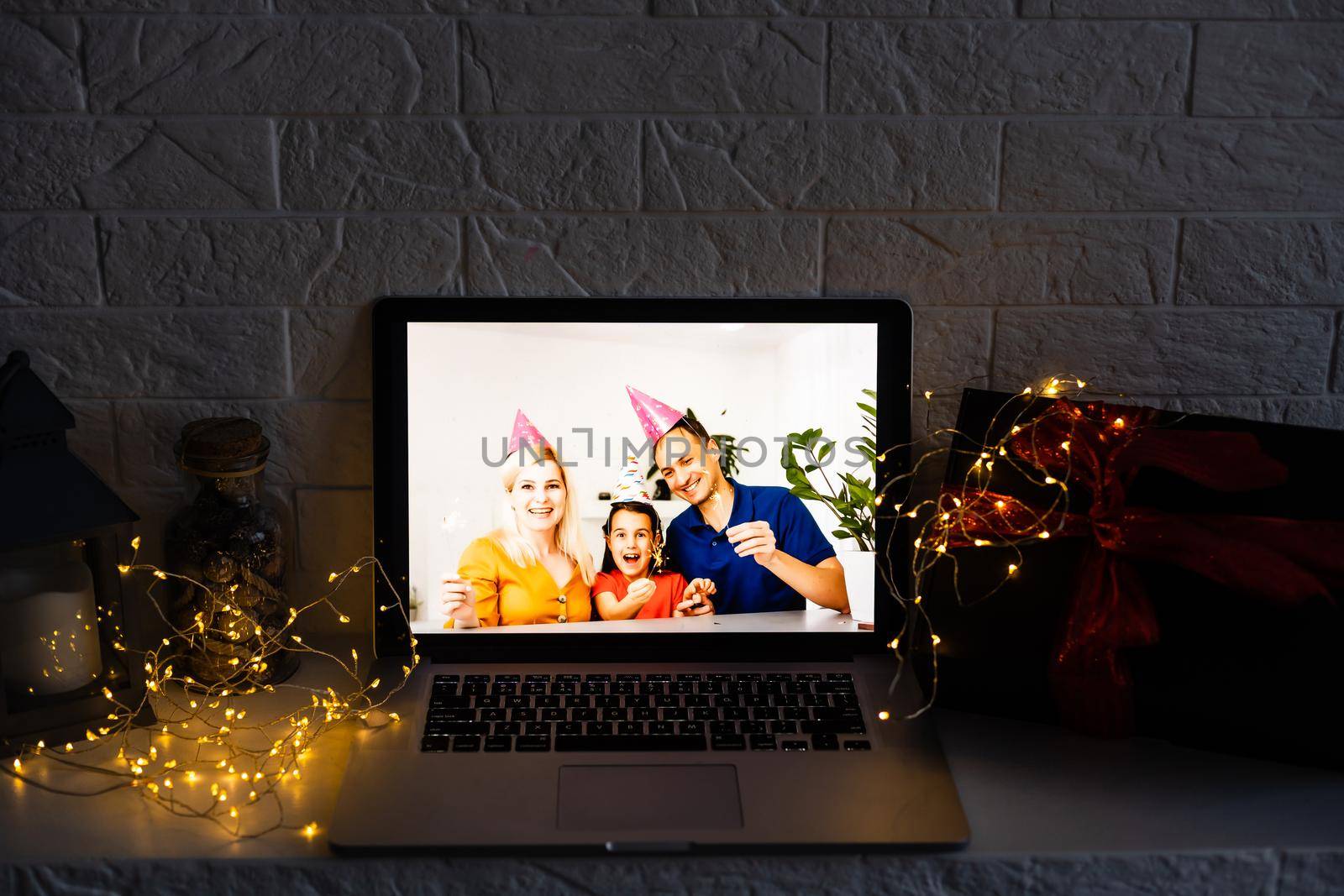 young family video call smiling and looking at webcam web, lovers greet friends merry christmas and happy new year.