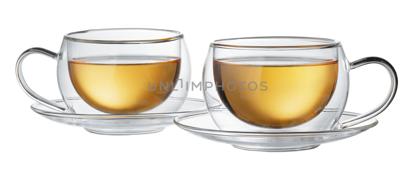 Two glass cups of tea isolated on white background