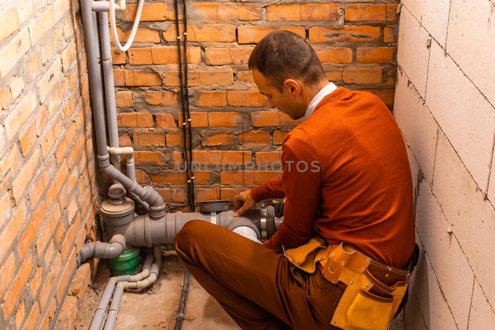 Technician servicing an hot-water heater.