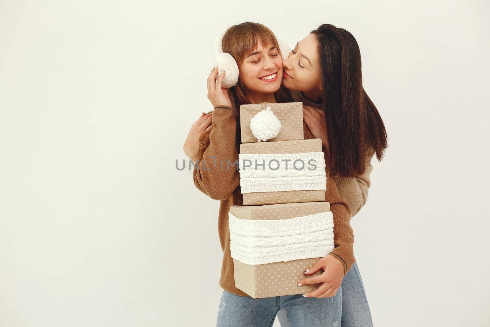 Beautiful girls have fun in a studio with presents by prostooleh