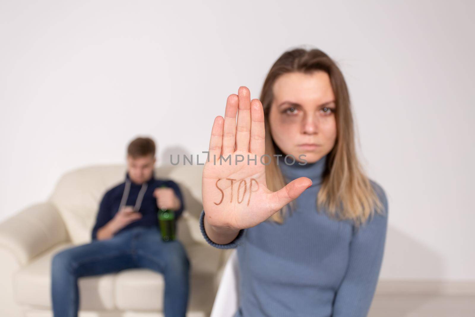 Alcoholism, abuse and problem concept - Sad woman shows stop sign, stop domestic violence.