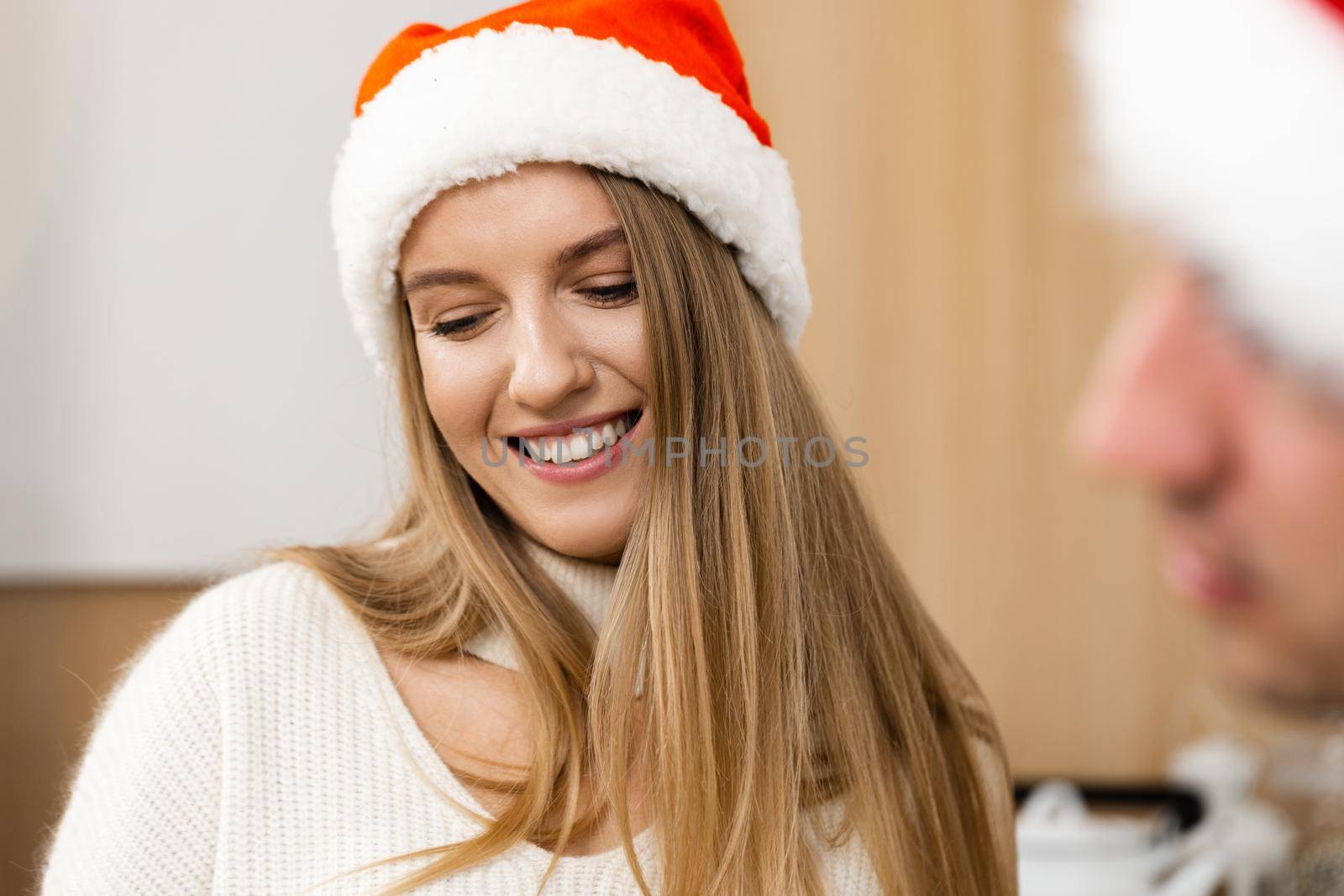 Young festive couple spending time togather in room, close up