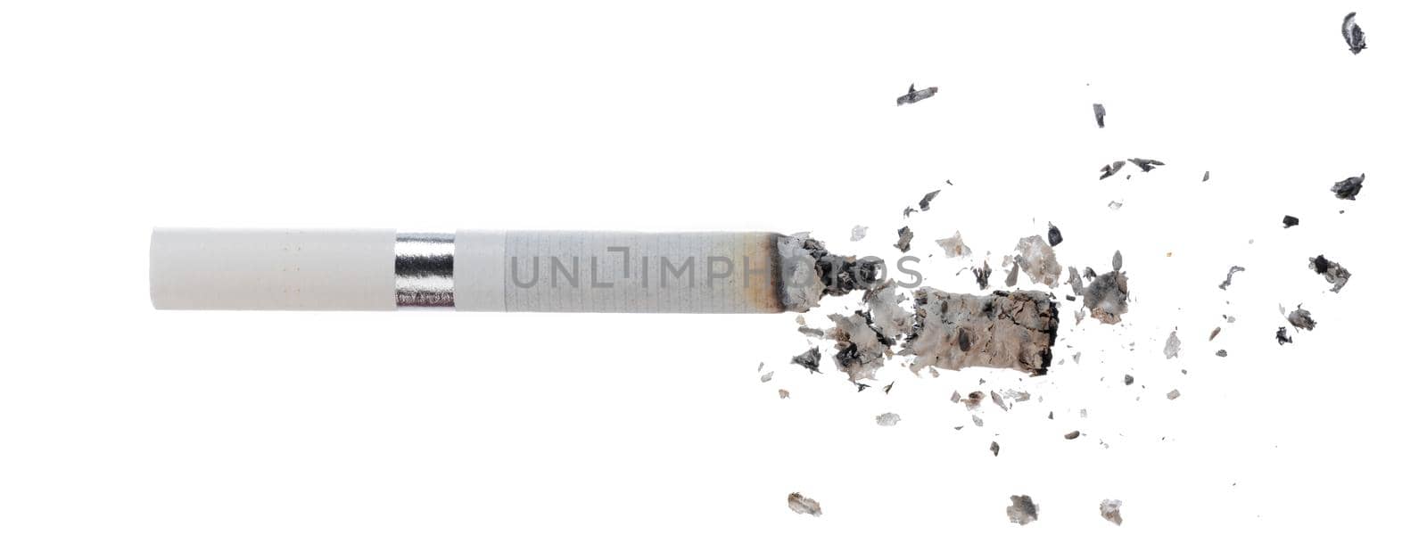 Lit cigarette isolated on white background close up top view