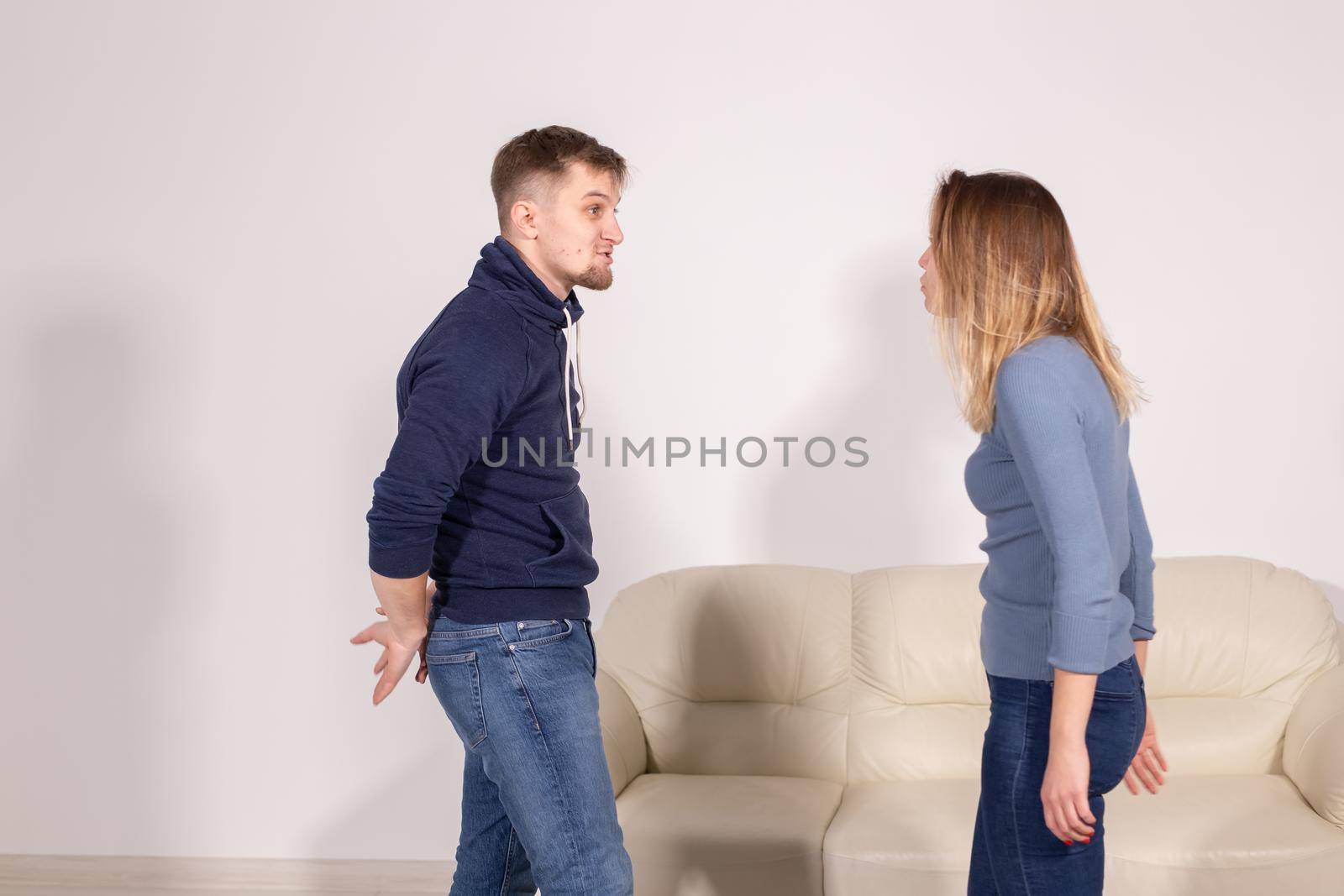 people, home violence and abuse concept - young couple screaming to each other by Satura86