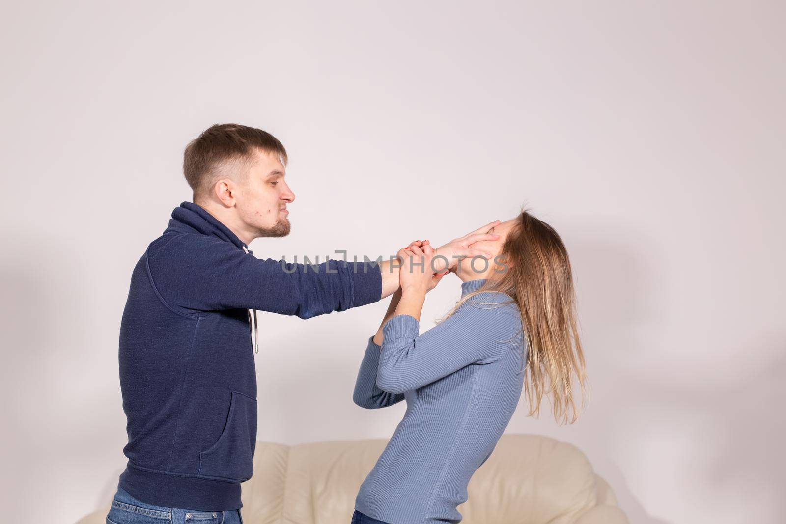 domestic violence, people and abuse concept - couple having fight and man slapping woman by Satura86