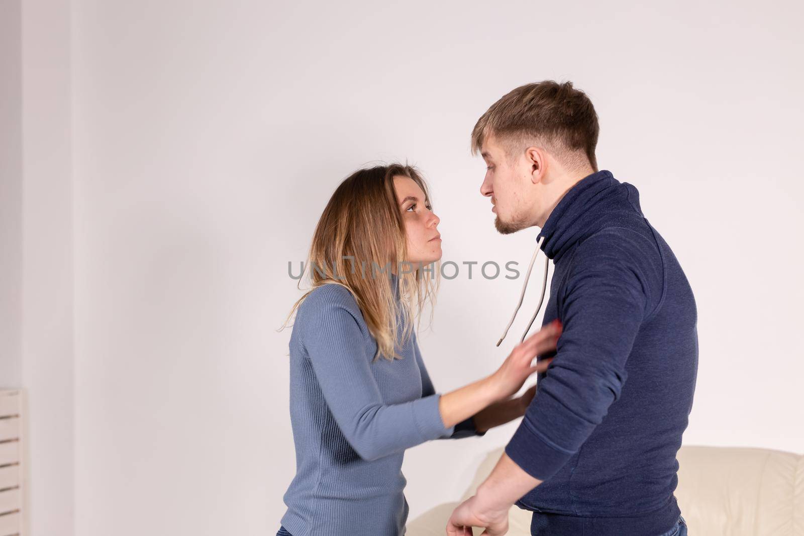 People, abuse and domestic violence concept - Portrait of man beating woman at home.