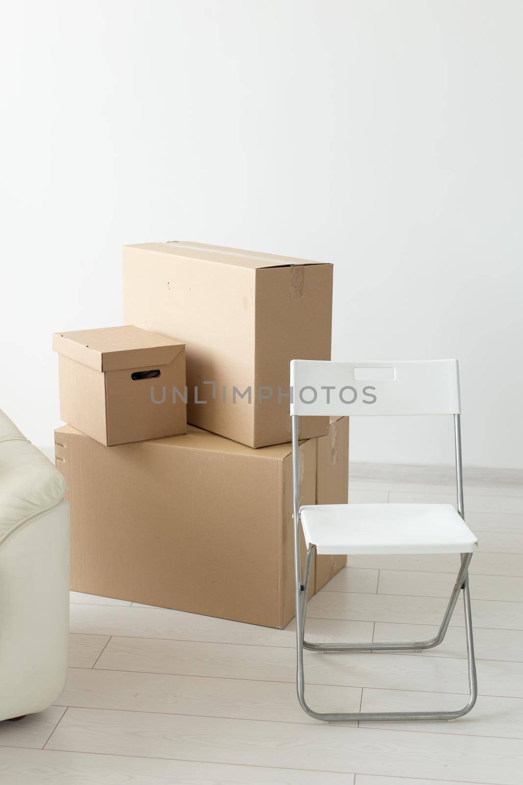 Boxes with things during the move of residents to a new apartment. The concept of home buying and the hassle of moving