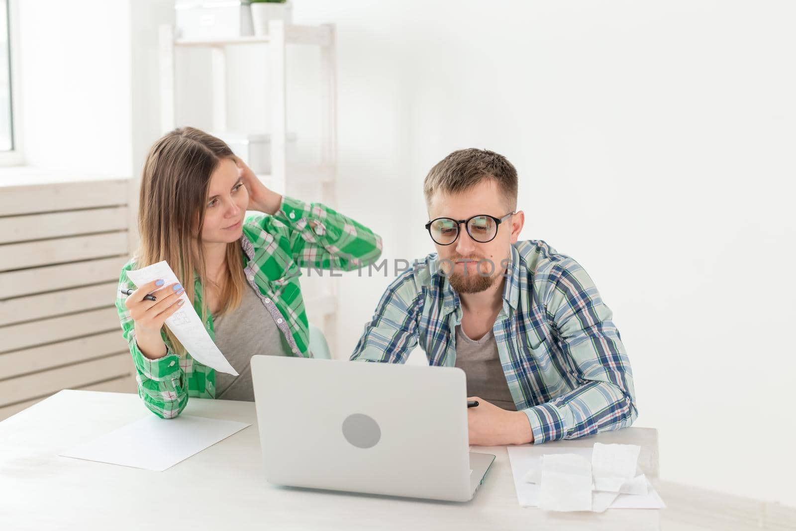 Upset husband and wife consider the total costs of payments and purchases made over the past month. The concept of low standard of living of students