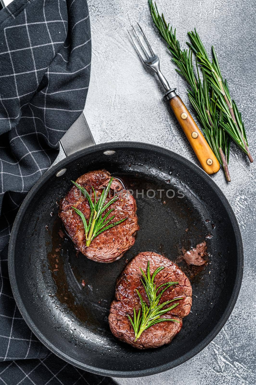 Roasted Fillet Mignon tenderloin meat beef steaks in pan. White background. Top view by Composter