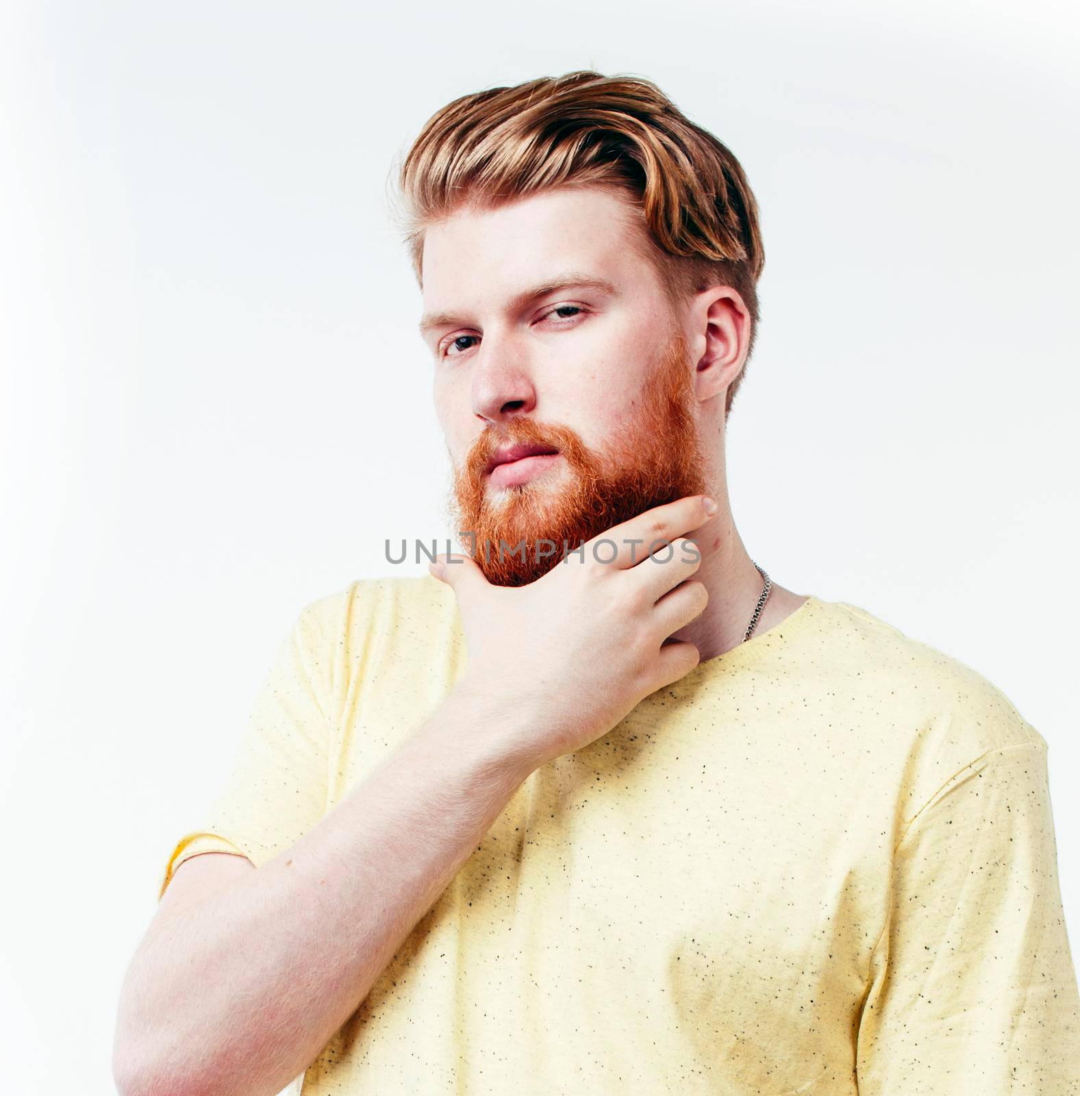 young handsome hipster ginger bearded guy looking brutal isolated on white background, lifestyle people concept close up