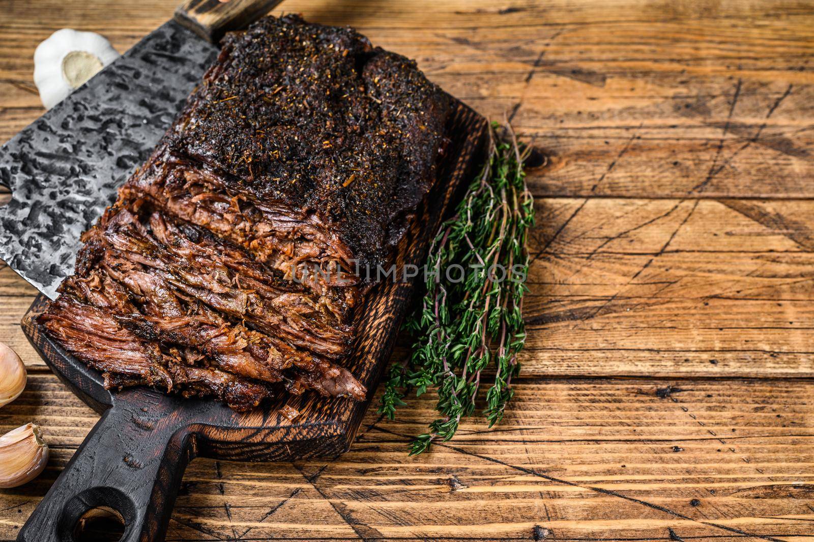 Homemade Smoked Barbecue Beef Brisket meat. wooden background. Top view. Copy space by Composter