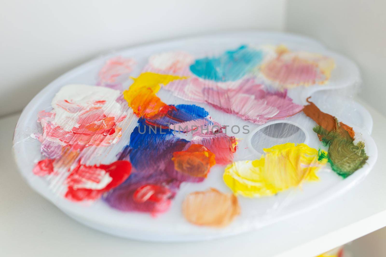 creativity, drawing and hobbies - palette with colorful paints.