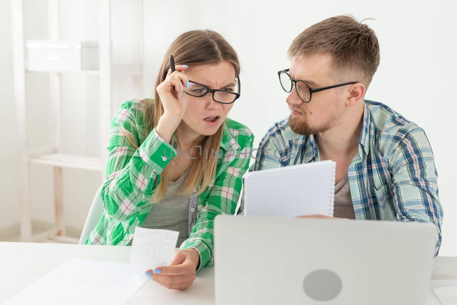 Upset husband and wife consider the total costs of payments and purchases made over the past month. The concept of low standard of living of students