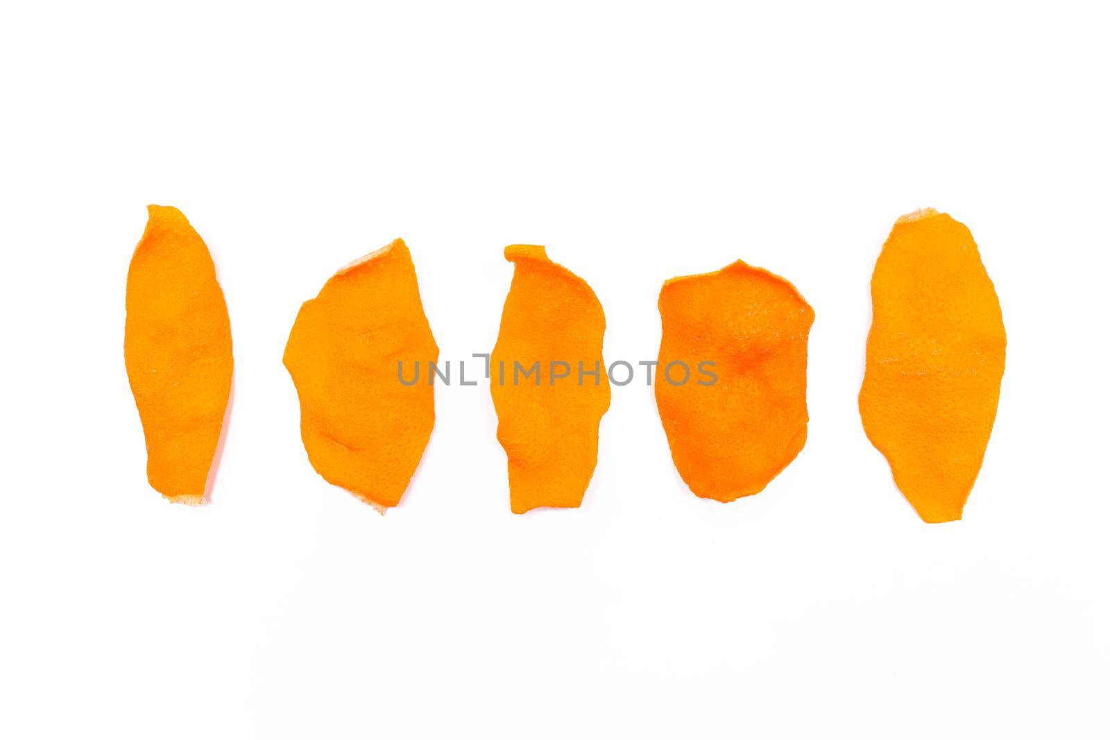 Dried orange peels isolated on a white background.