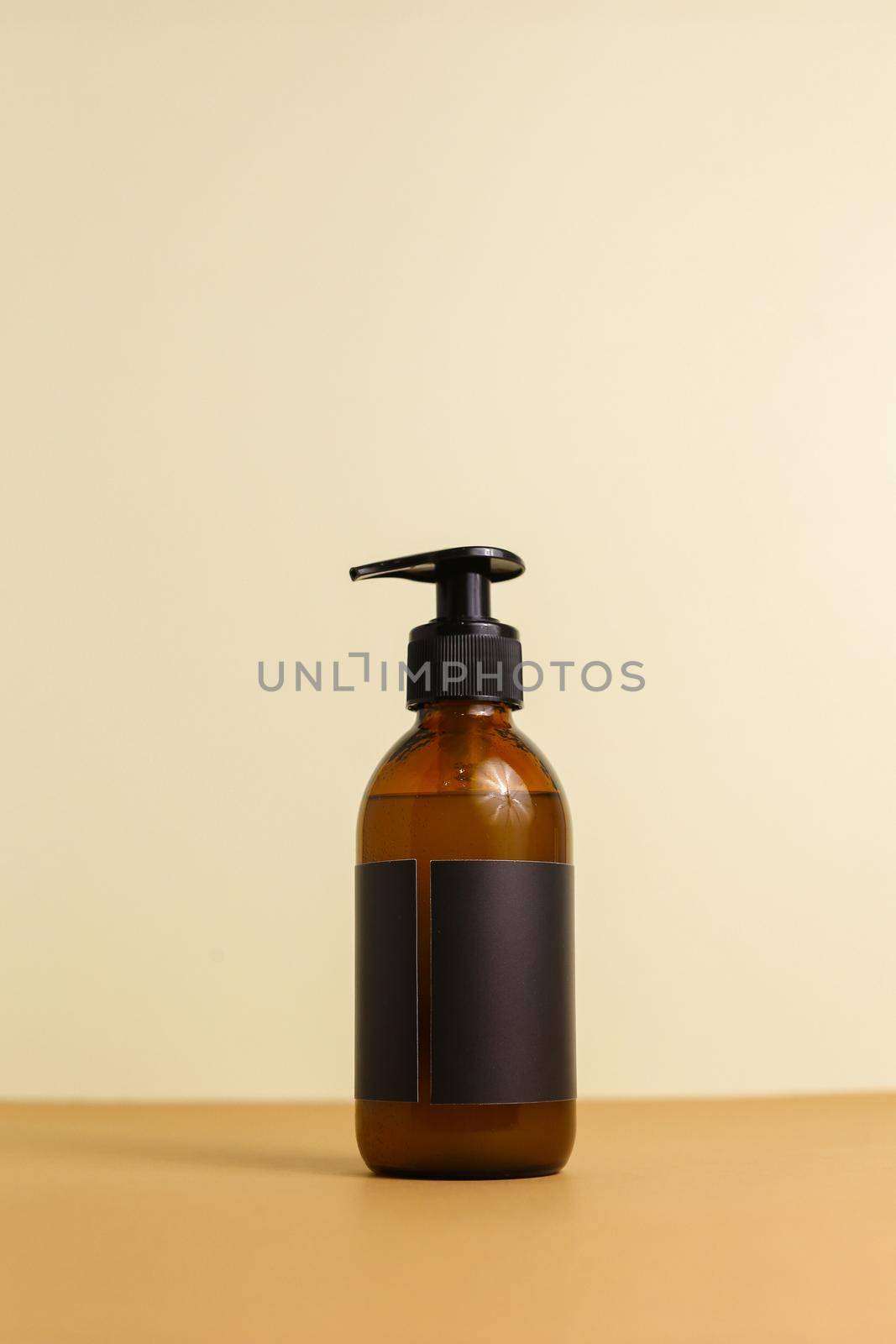 Beauty natural skincare products development concept. Dermatologist cosmetic skincare bottle with pump dispenser and organic ingredient on neutral background. by sisterspro