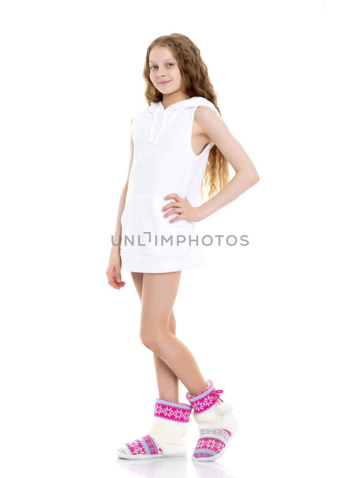 Emotional little girl in a clean white T-shirt. The concept can be used to advertise goods and services, whose logo can be printed on the surface of the shirt. Isolated on white background