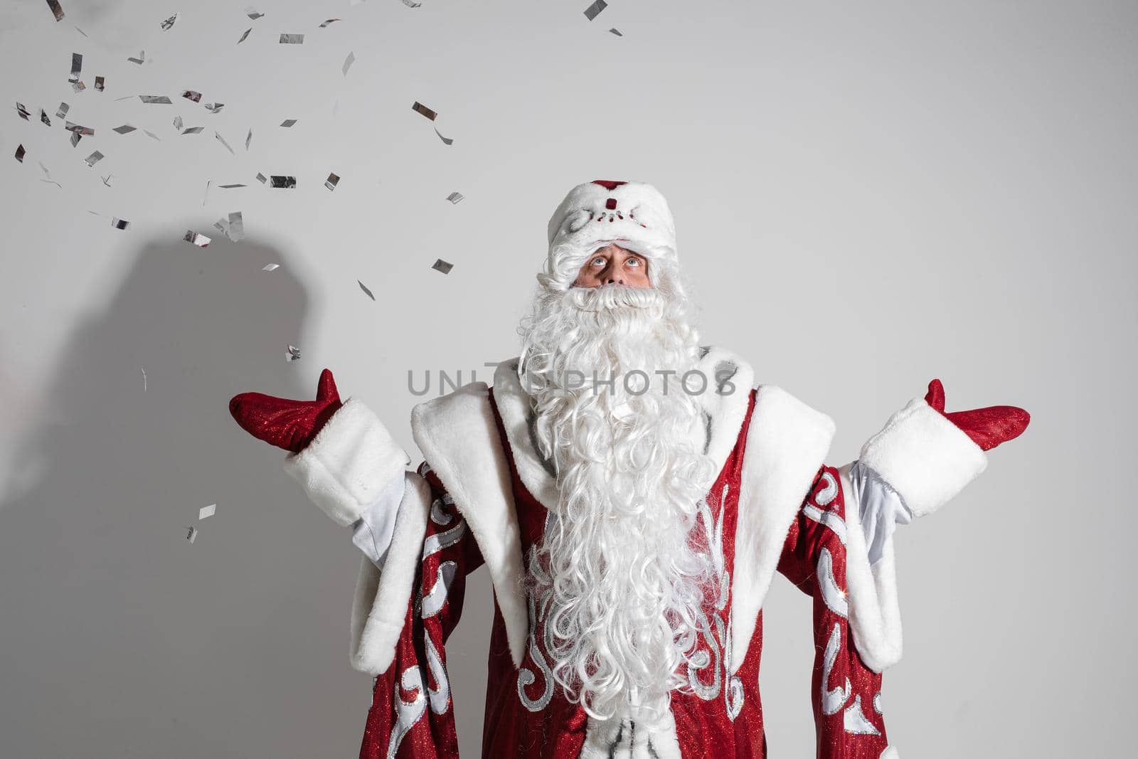 santa claus with long white beard rejoices of christmas eve, picture isolated on white background