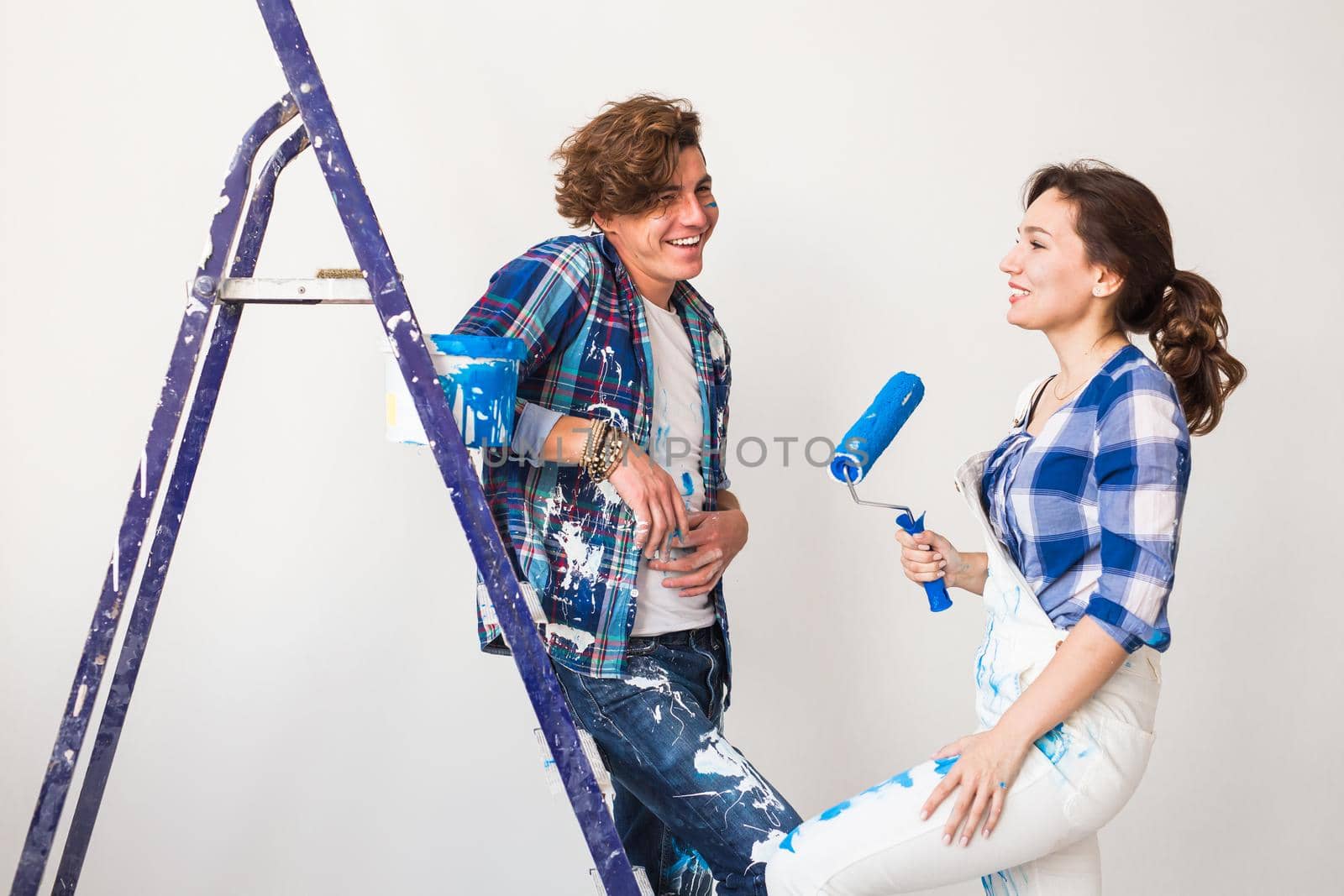 People, renovation and repair concept - Portrait of lovely couple doing redecoration in apartment by Satura86