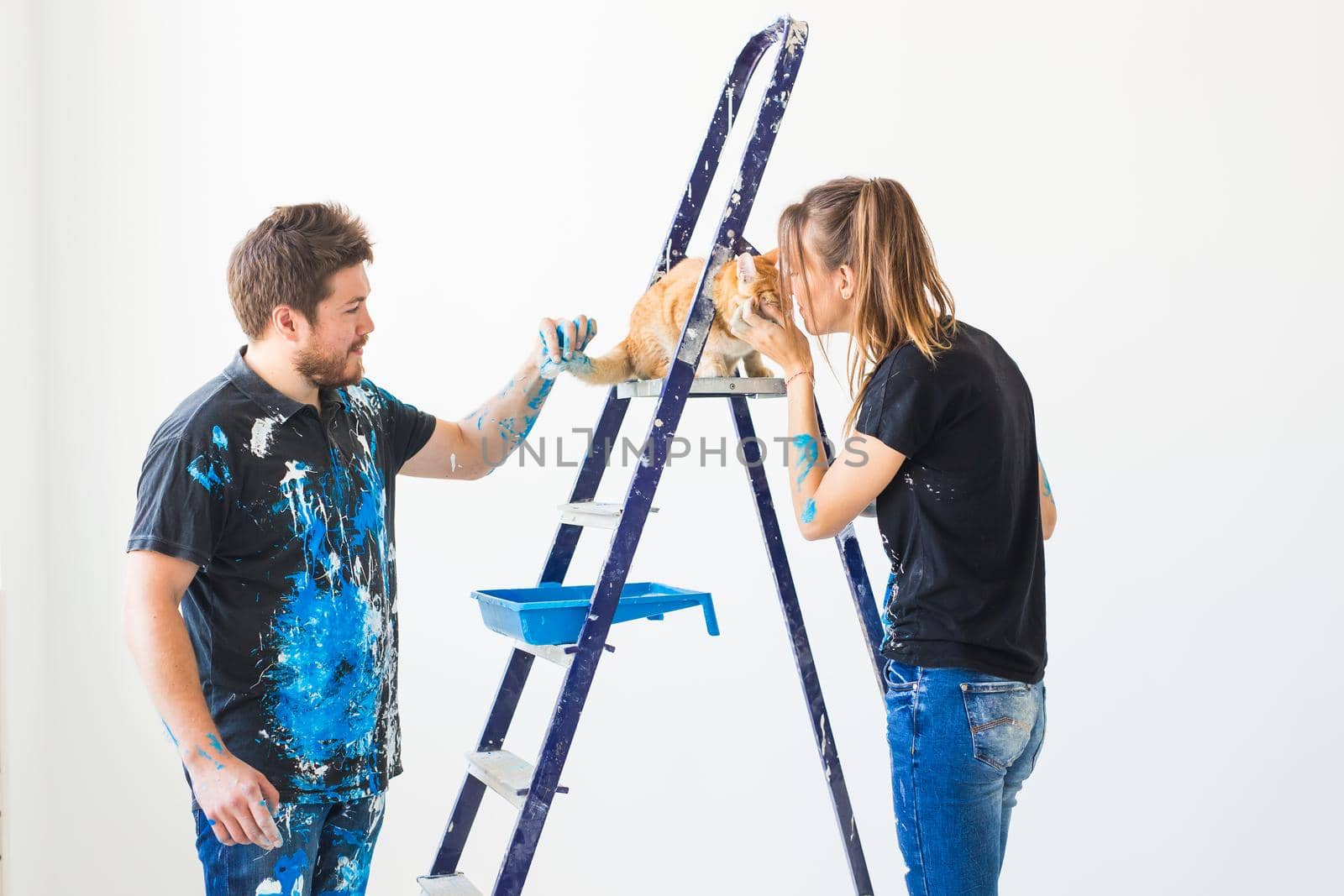 People, renovation and repair concept - Portrait of lovely couple doing redecoration in apartment.