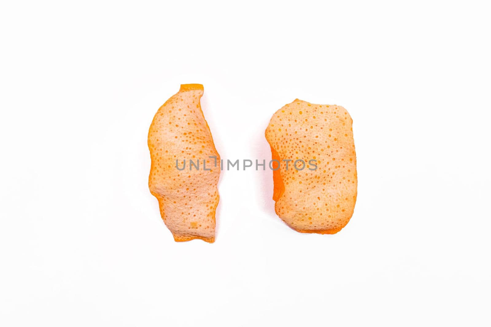 2 Dried orange peels isolated on a white background, close-up.