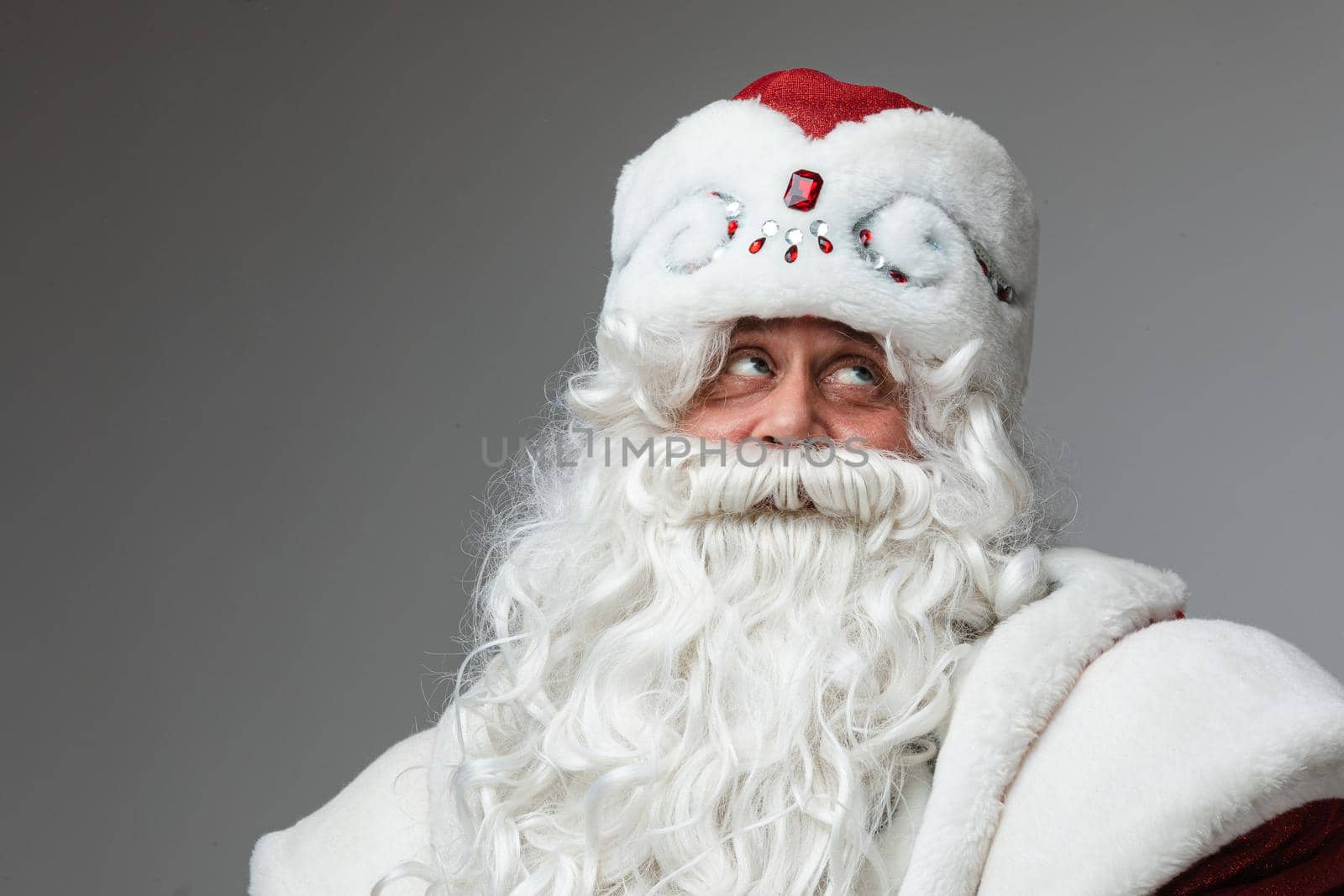 Pensive Father Frost in hat with white beard. by StudioLucky