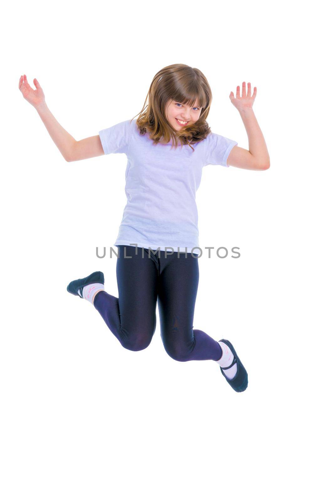 A teenage girl jumps and wags her arms. The concept of a holiday. Isolated on white background