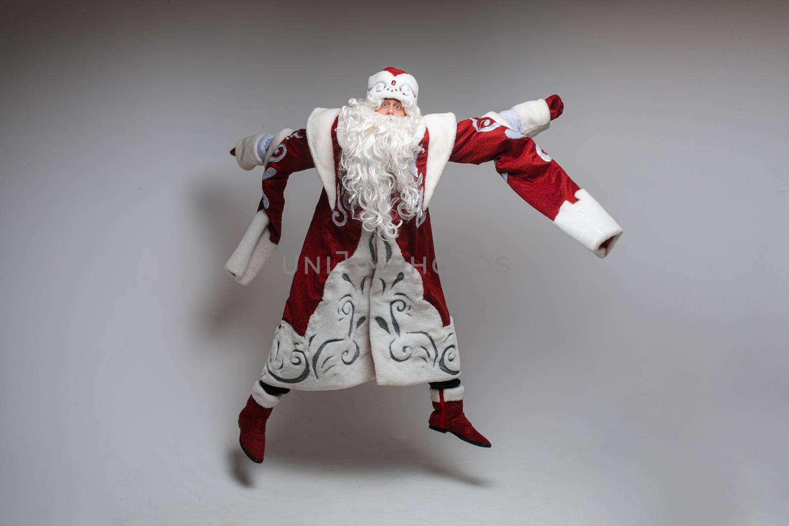 picture of old santa claus jumps and rejoices in the studio by StudioLucky