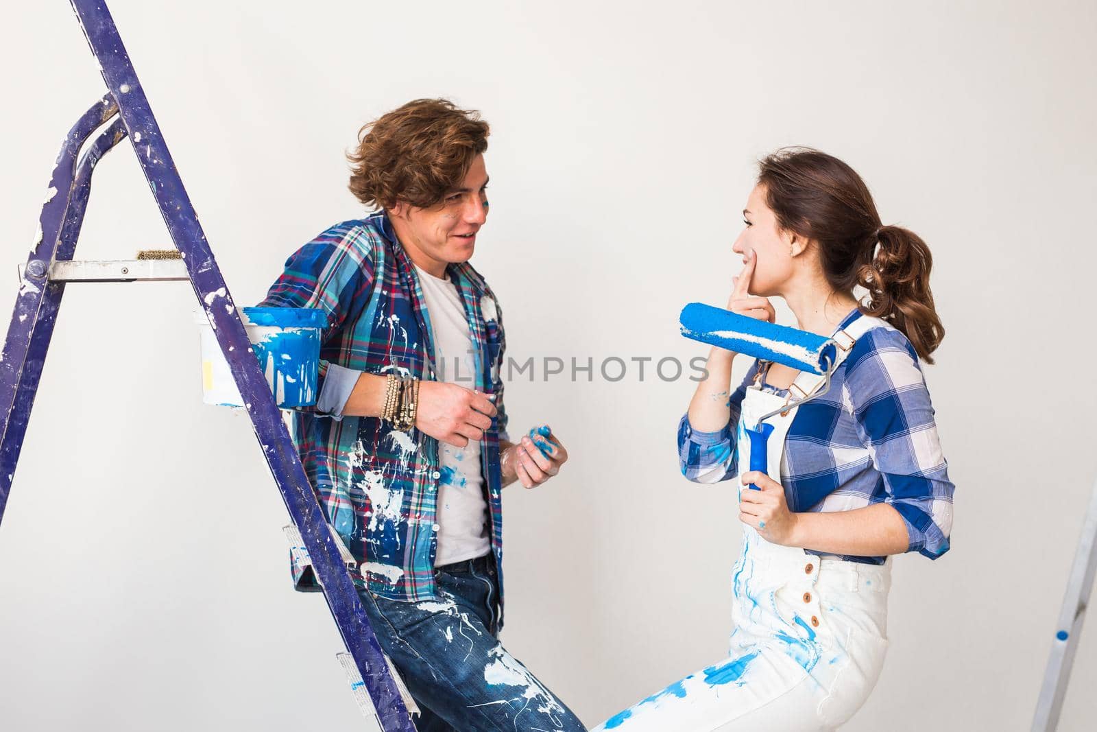 People, renovation and repair concept - Portrait of lovely couple doing redecoration in apartment by Satura86