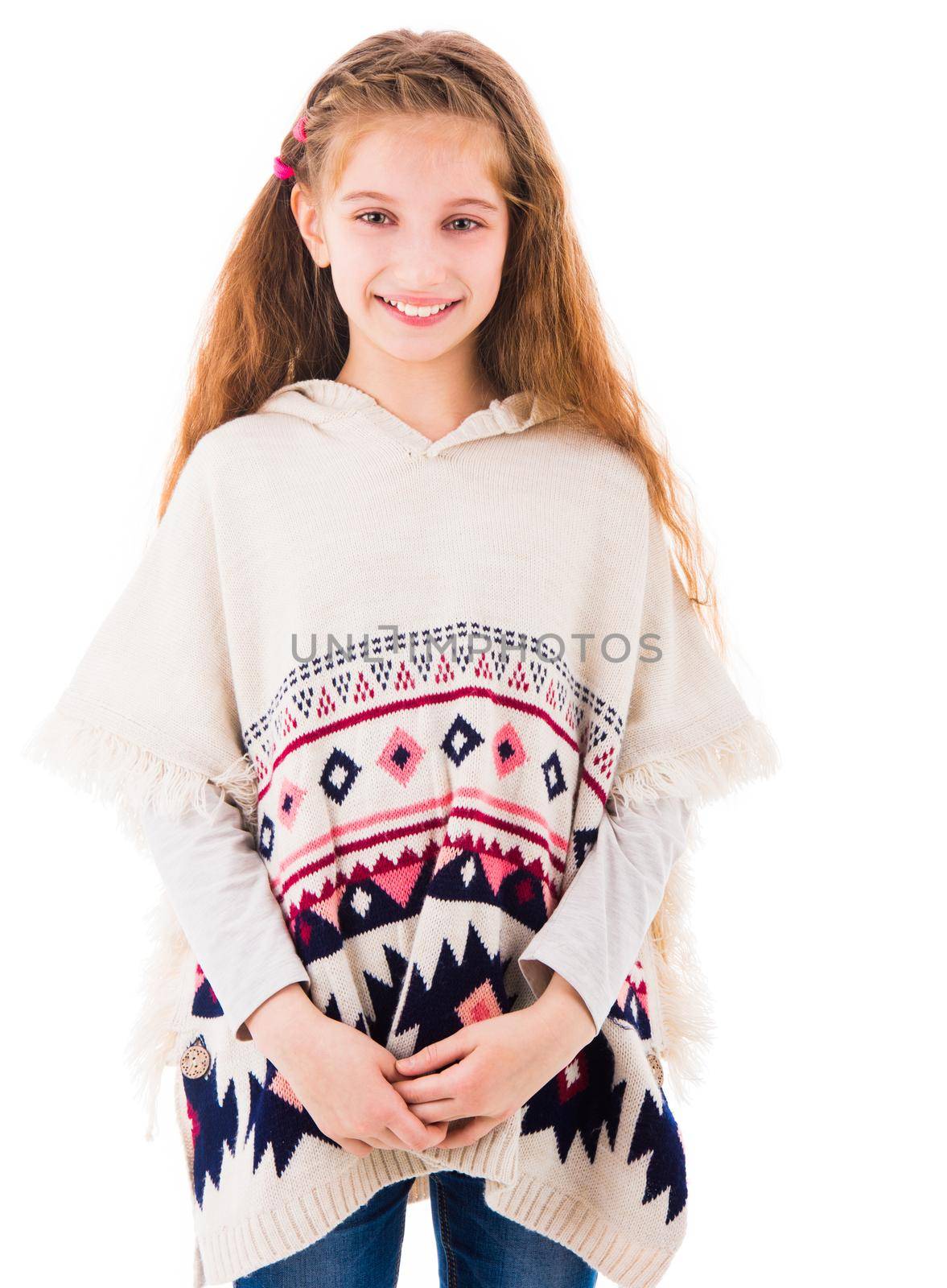 Beautiful young teen girl with long hair wearing knitted poncho isolated on white background