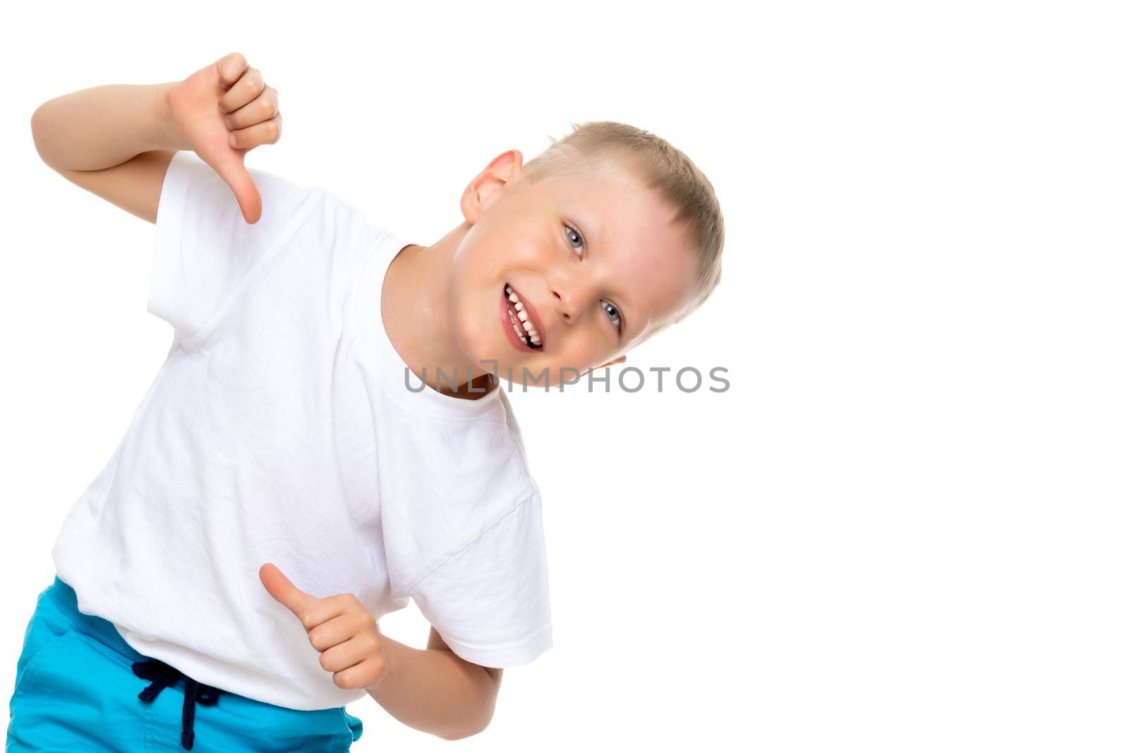 A cute little boy in a clean white T-shirt is pointing fingers at himself. The concept can be used to promote any products whose logo can be put on the surface of clothing.Isolated on a white background.