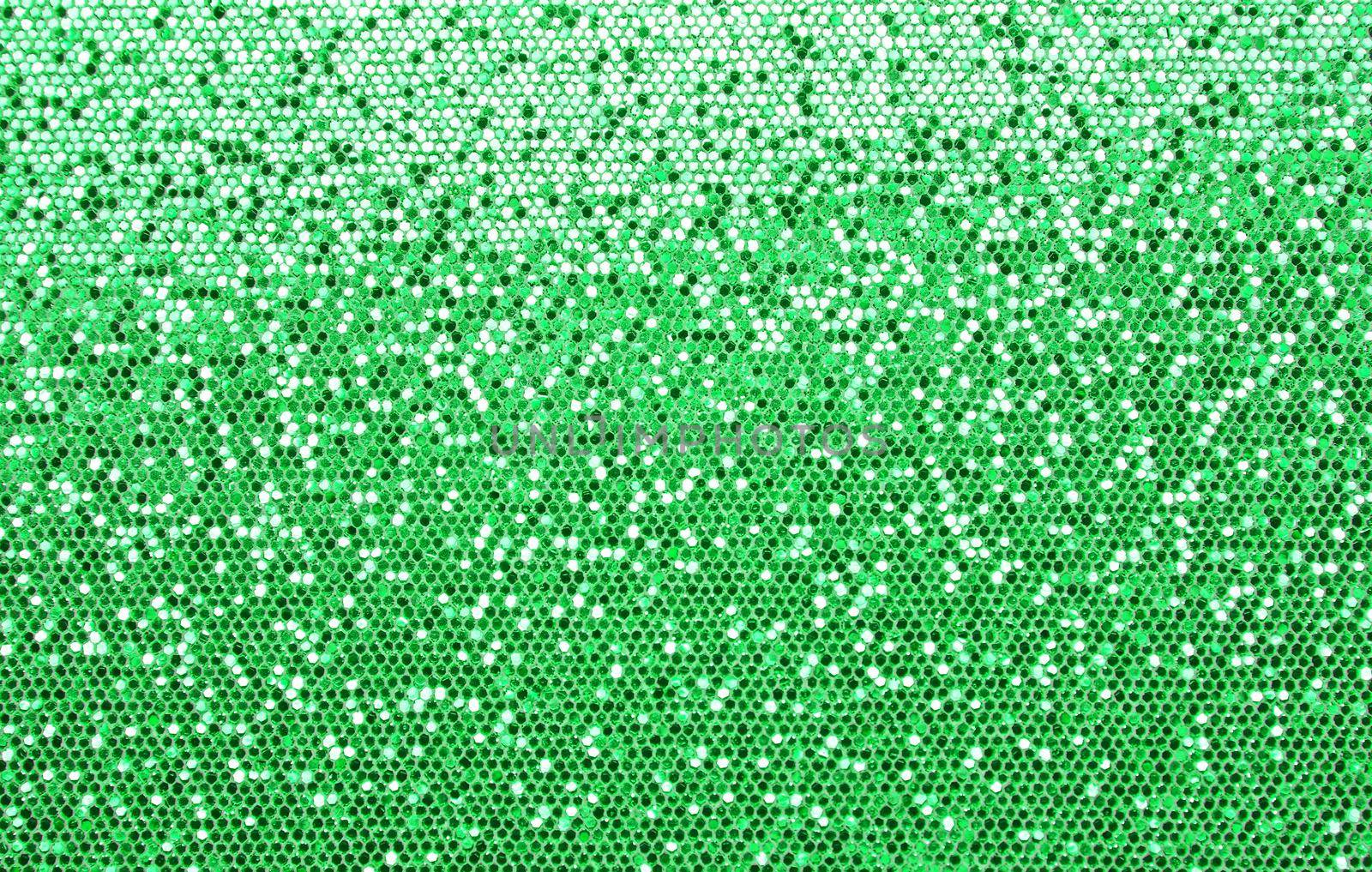 Abstract background texture of shiny green glitter pattern light gradient