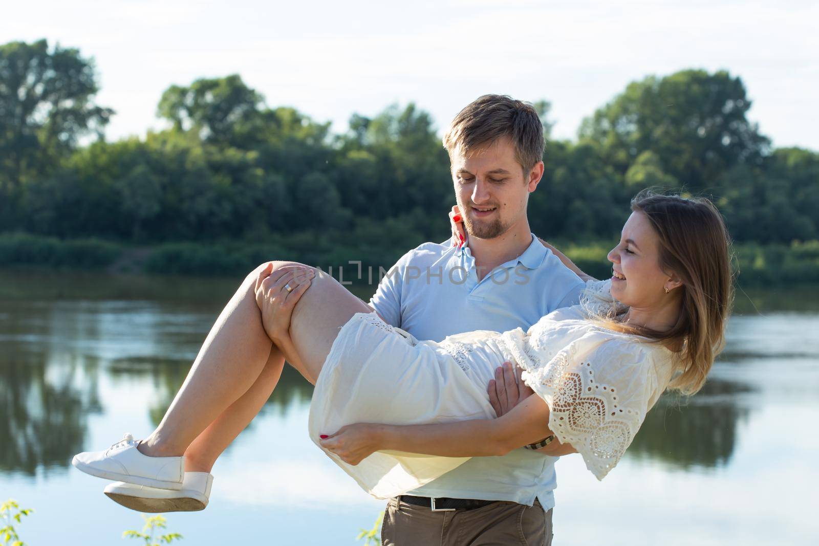 happy romantic couple in love and having fun outdoor in summer day, beauty of nature, harmony concept.