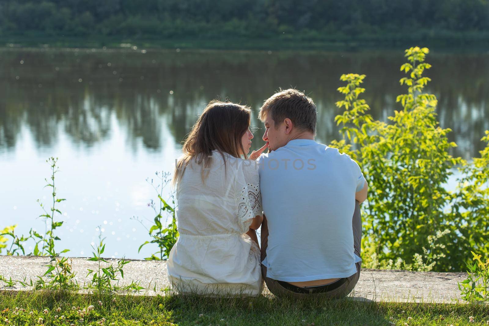 Young couple in love outdoor.Stunning sensual outdoor portrait of young stylish fashion couple posing in summer by Satura86